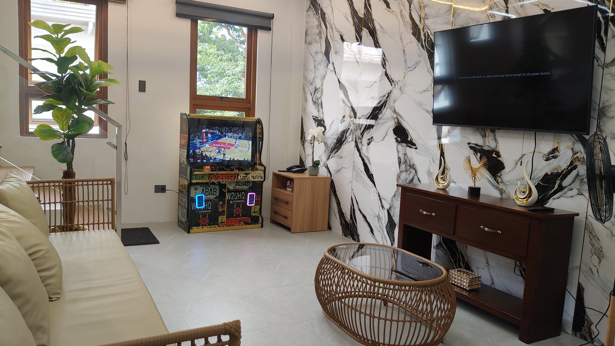 Entertainment lounge with arcade game and television
