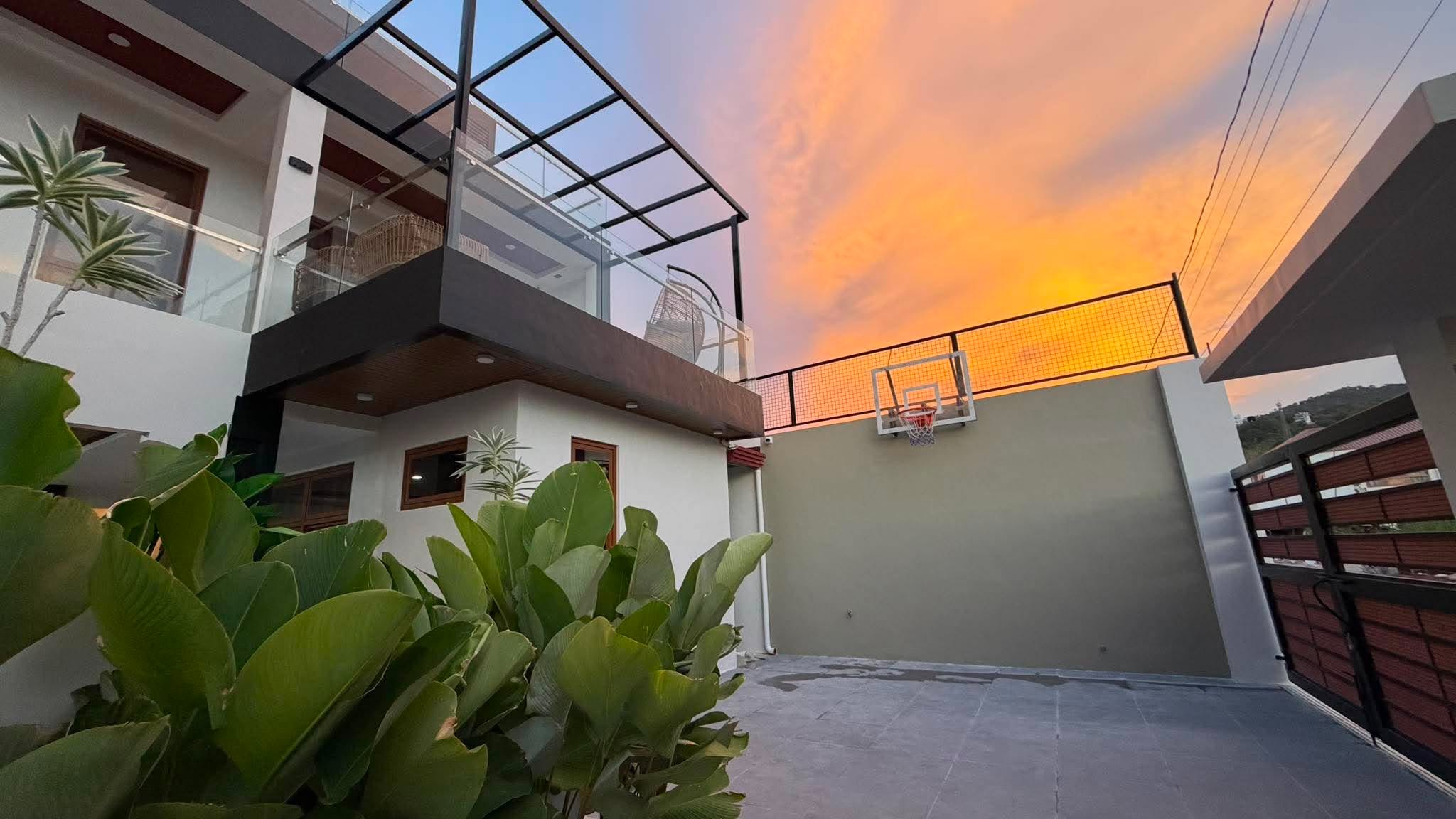 Private half-court basketball area at sunset