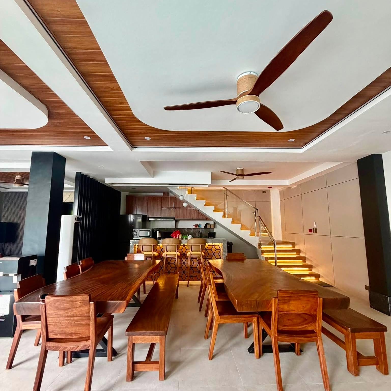Large indoor dining area with wood tables