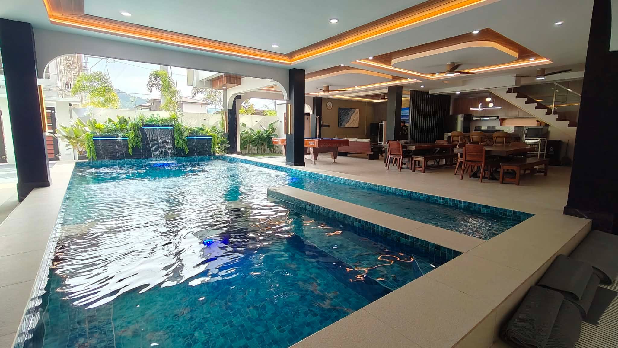 Natural hot spring adult and kiddie pools beside the open lounge