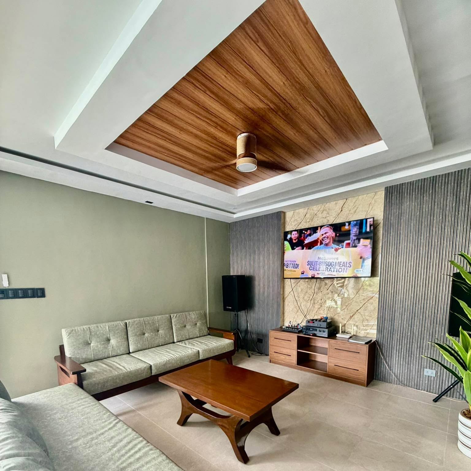 Air-conditioned karaoke lounge with large television